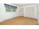 Spacious bedroom with plush carpet, large closet and window with valance at 215 Jan Mar Dr, China Grove, NC 28023