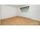 Bedroom featuring plush carpet, window with patterned valance, and neutral paint at 215 Jan Mar Dr, China Grove, NC 28023