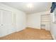 Bedroom boasts plush carpeting, built-in shelving, and closet with paneled doors at 215 Jan Mar Dr, China Grove, NC 28023