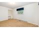 Bright bedroom featuring a built-in desk and shelving unit beside a sunlit window at 215 Jan Mar Dr, China Grove, NC 28023