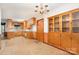 Bright dining area featuring built-in cabinets adjacent to the kitchen with tile floors at 215 Jan Mar Dr, China Grove, NC 28023