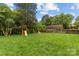 Large backyard with playset, offering ample space for recreation and Gathering fun at 227 Wingrave Dr, Charlotte, NC 28270