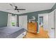 Bedroom showing a dresser, ceiling fan, and access to the ensuite bathroom at 227 Wingrave Dr, Charlotte, NC 28270