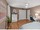 Bedroom featuring hardwood floors, ample natural light, and a workspace area at 227 Wingrave Dr, Charlotte, NC 28270