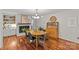 Dining room with hardwood floors, decorative fireplace, and seamless transition into other living spaces at 227 Wingrave Dr, Charlotte, NC 28270