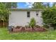 Exterior view of home with garden boxes ready for your favorite flowers, vegetables and herbs at 227 Wingrave Dr, Charlotte, NC 28270