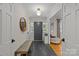 Bright entryway featuring stylish slate flooring, a cushioned bench, and open access to the living spaces at 227 Wingrave Dr, Charlotte, NC 28270