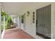 Inviting front porch with porch swing and stylish lighting fixtures creates a welcoming entrance at 227 Wingrave Dr, Charlotte, NC 28270