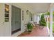 Charming front porch featuring stylish accents, comfortable seating and a welcoming open door at 227 Wingrave Dr, Charlotte, NC 28270