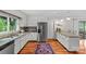 Spacious kitchen featuring granite countertops, stainless steel appliances, with island seating at 227 Wingrave Dr, Charlotte, NC 28270