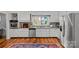 Modern kitchen with stainless steel appliances, granite countertops, and a window view to the backyard at 227 Wingrave Dr, Charlotte, NC 28270