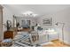 Bright and airy living room with a cozy sectional, patterned rug, and open layout at 227 Wingrave Dr, Charlotte, NC 28270