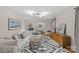 Spacious living room with a comfortable sectional sofa, area rug, and elegant decor at 227 Wingrave Dr, Charlotte, NC 28270