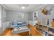 Cozy playroom featuring a blue couch, road-themed table, guitar, and playful wall decor for enjoyment at 227 Wingrave Dr, Charlotte, NC 28270