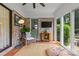 Cozy sunroom featuring brick walls, modern furnishings, and natural light at 227 Wingrave Dr, Charlotte, NC 28270
