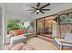 Relaxing sunroom with brick accents, comfortable seating, and lots of natural light at 227 Wingrave Dr, Charlotte, NC 28270