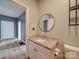 Bathroom features granite vanity, round mirror, and vinyl flooring at 2440 Myers St, Gastonia, NC 28056