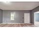 Inviting living room featuring sleek, modern floors, neutral walls, and a bright window at 2440 Myers St, Gastonia, NC 28056