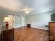 Spacious bedroom featuring a ceiling fan and sliding barn door to closet at 2619 Quailrush Rd, Charlotte, NC 28226