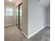 Bedroom featuring soft carpet, neutral paint, sliding door closet, and natural light from a window at 2619 Quailrush Rd, Charlotte, NC 28226