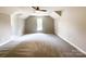 Spacious bedroom features vaulted ceilings, soft carpet, a ceiling fan, and a window for natural light at 2619 Quailrush Rd, Charlotte, NC 28226