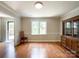 Light-filled dining room with hardwood floors and classic wood trim at 2619 Quailrush Rd, Charlotte, NC 28226