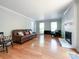 Inviting living room featuring hardwood floors, a cozy seating area, and a charming fireplace at 2619 Quailrush Rd, Charlotte, NC 28226