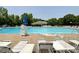Community pool with ample seating, a lifeguard stand, and a well-maintained pool house at 2619 Quailrush Rd, Charlotte, NC 28226