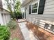 Side yard walkway with mature landscaping and convenient access to the home's exterior at 2619 Quailrush Rd, Charlotte, NC 28226