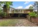Exterior of house with a backyard and a wooden deck at 2666 Providence Dr, Gastonia, NC 28052