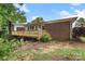 View of the backyard with deck and brick exterior at 2666 Providence Dr, Gastonia, NC 28052