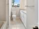 Bathroom featuring tile floors, toilet, and granite counter vanity with cabinets at 2666 Providence Dr, Gastonia, NC 28052