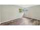 Comfortable bedroom with wood floors and a bright window with green views at 2666 Providence Dr, Gastonia, NC 28052