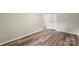 Well-lit bedroom featuring wood-look floors and a spacious closet at 2666 Providence Dr, Gastonia, NC 28052