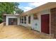 Wooden deck overlooking backyard with entry door to the house at 2666 Providence Dr, Gastonia, NC 28052
