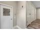 Hallway with access door to backyard, tile flooring, and a closet at 2666 Providence Dr, Gastonia, NC 28052