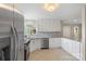 Renovated kitchen with stainless steel appliances, granite counters, and white cabinetry at 2666 Providence Dr, Gastonia, NC 28052