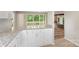 Modern kitchen features granite countertops, white cabinetry, and opens to living area at 2666 Providence Dr, Gastonia, NC 28052