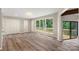 Spacious living room features hardwood floors, large windows with scenic views, and two closets at 2666 Providence Dr, Gastonia, NC 28052