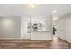 Open-concept living room adjacent to kitchen, features hardwood floors and natural light at 2666 Providence Dr, Gastonia, NC 28052