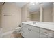 Standard bathroom with a white vanity, sink, toilet, and a large mirror over the vanity at 300 W 5Th St # 812, Charlotte, NC 28202
