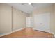 Neutral bedroom featuring laminate floors, large double door closet, and neutral paint at 300 W 5Th St # 812, Charlotte, NC 28202