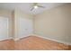 Neutral bedroom featuring laminate floors, large double door closet, and neutral paint at 300 W 5Th St # 812, Charlotte, NC 28202
