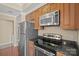 Modern kitchen featuring stainless steel appliances and granite countertops at 300 W 5Th St # 812, Charlotte, NC 28202