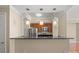 Close-up of the kitchen featuring stainless steel appliances and a bar counter at 300 W 5Th St # 812, Charlotte, NC 28202