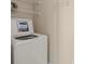 Laundry room featuring a top-loading washer and storage racks at 300 W 5Th St # 812, Charlotte, NC 28202