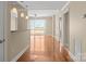 Spacious living room with hardwood floors offering an open layout and balcony access at 300 W 5Th St # 812, Charlotte, NC 28202