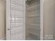 Walk-in pantry with adjustable wire shelving for optimal storage and organization at 300 W 5Th St # 812, Charlotte, NC 28202