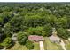Aerial view of a quiet, tree-filled neighborhood featuring well-maintained homes and green lawns at 303 Jean Ave, Kannapolis, NC 28083