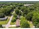 Aerial view of a wooded neighborhood showing a home with a brown roof at 303 Jean Ave, Kannapolis, NC 28083